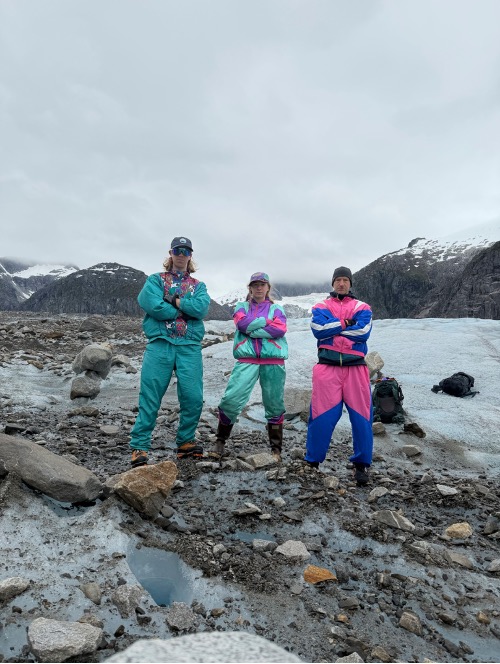 ACRC members pose on a glacier in brightly colored clothing