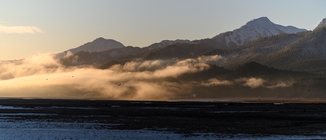 clouds and mountains on the coast of Alaska