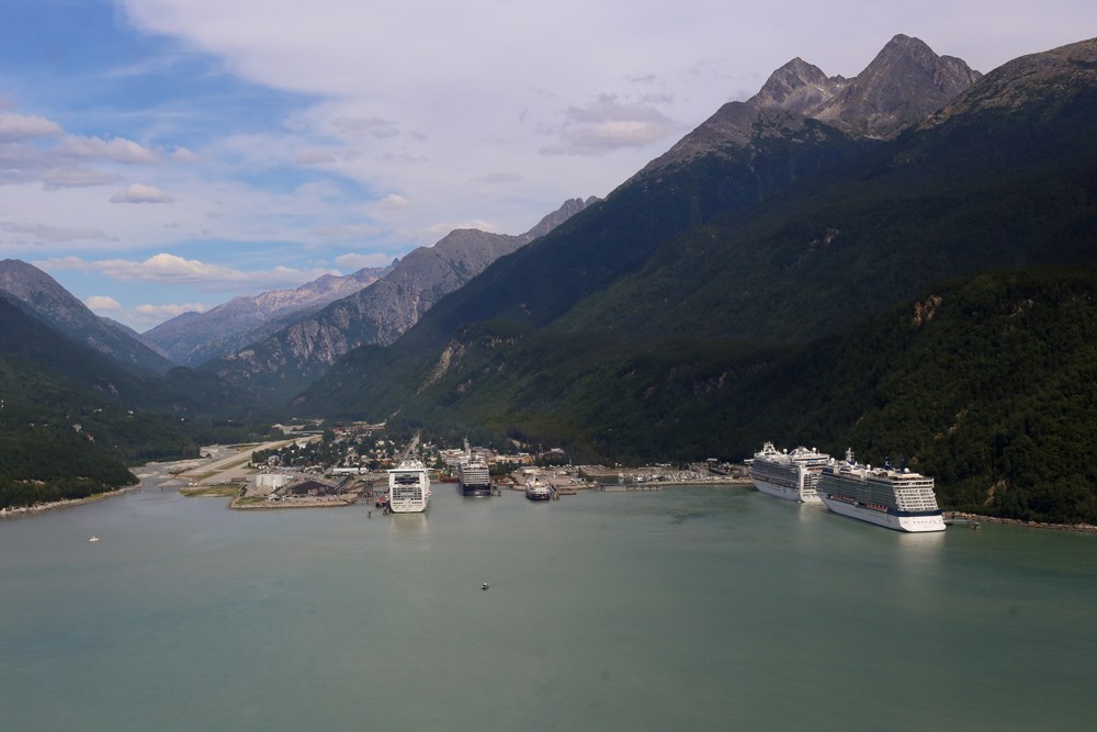 the town of skagway viewed from above, with cruise ships docked